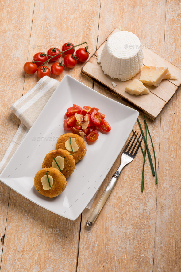 vegetarian ricotta cheese hamburger with tomatoes salad Stock Photo by